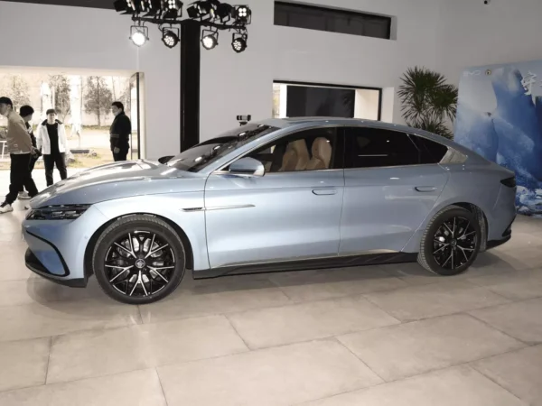 Side view of the light blue BYD Han electric car.