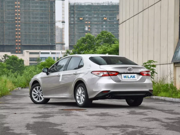 Left rear view of a silver Toyota CAMRY 2.5Q electric vehicle.