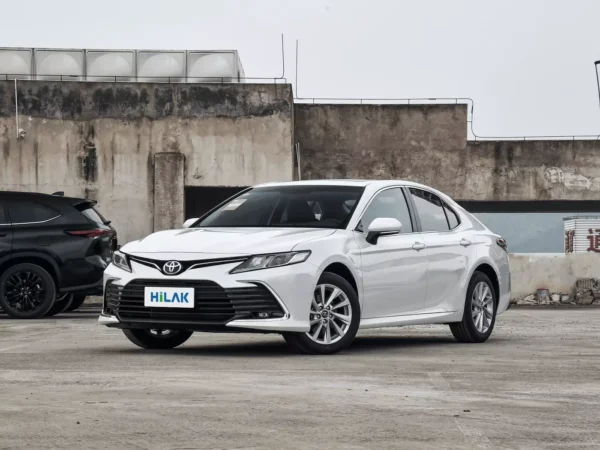 Left front view of a white Toyota CAMRY 2.5Q electric vehicle.