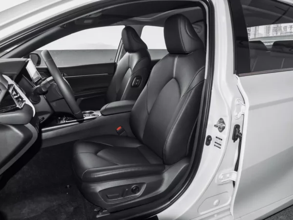 Front cab view of a white Toyota CAMRY 2.5Q electric vehicle.