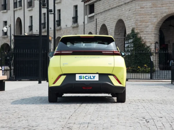 A picture of a yellow BYD Seagull rear end with several red lights and a license plate with the Sicily logo on it.