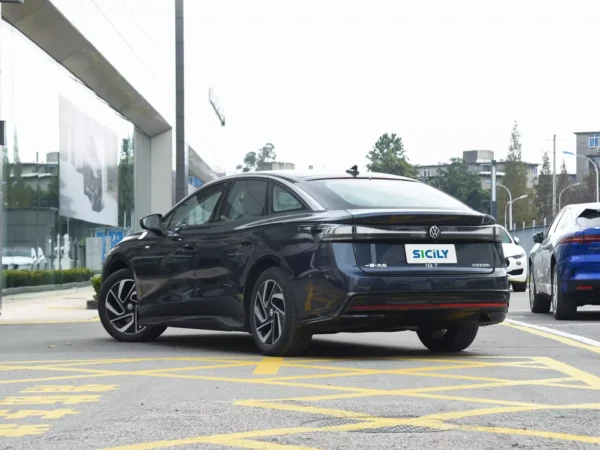 A picture of a dark blue Volkswagen ID.7 Vizzion side and rear angle with yellow markings on the road.