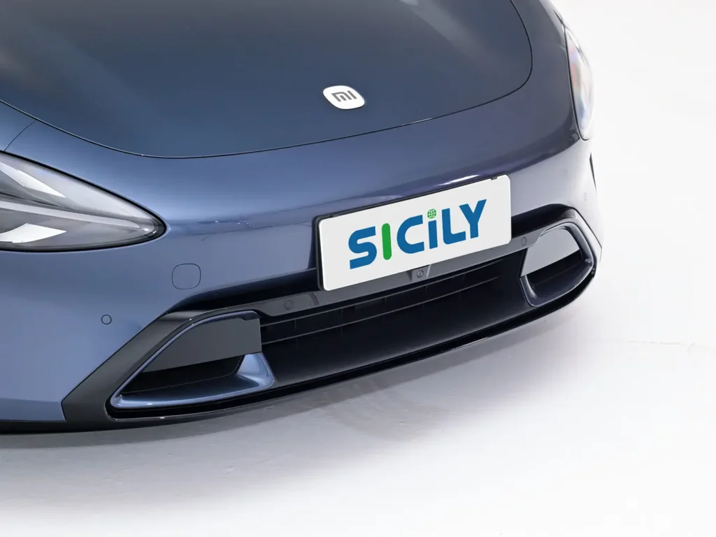 The air channel under the license plate of Sicily in a dark blue Xiaomi SU7 electric car