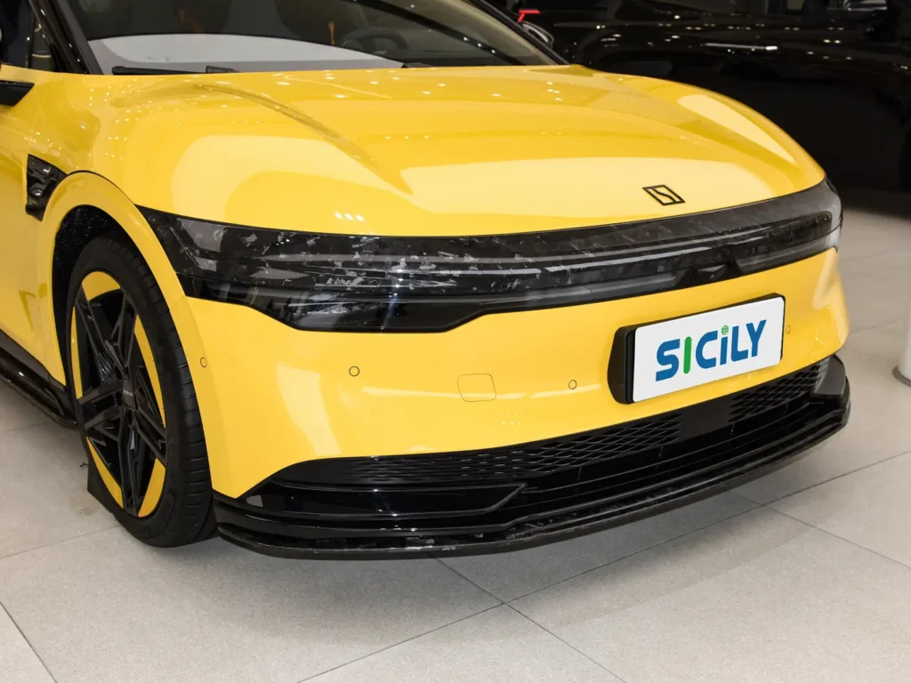 The first half of a yellow Zeekr 007 with a license plate of Sicily