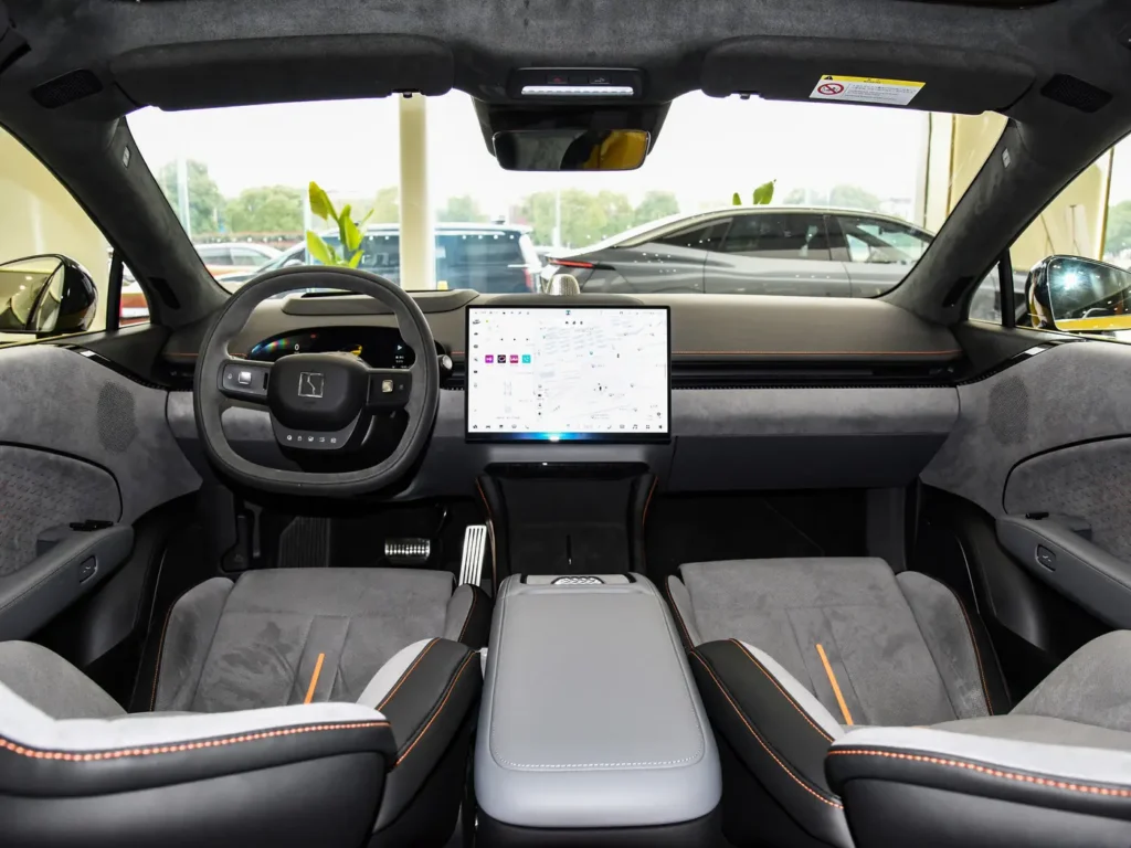 A grey interior with some orange lines of Zeekr 007 electric car