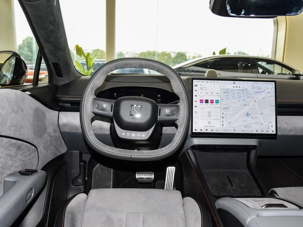 A grey suede steering wheel in a grey interior Zeekr 007 electric car