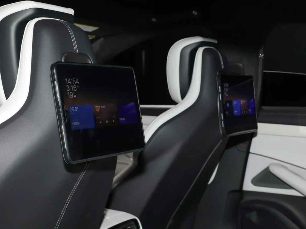 Two car seats with two flat panels attached in Xiaomi SU7 electric car