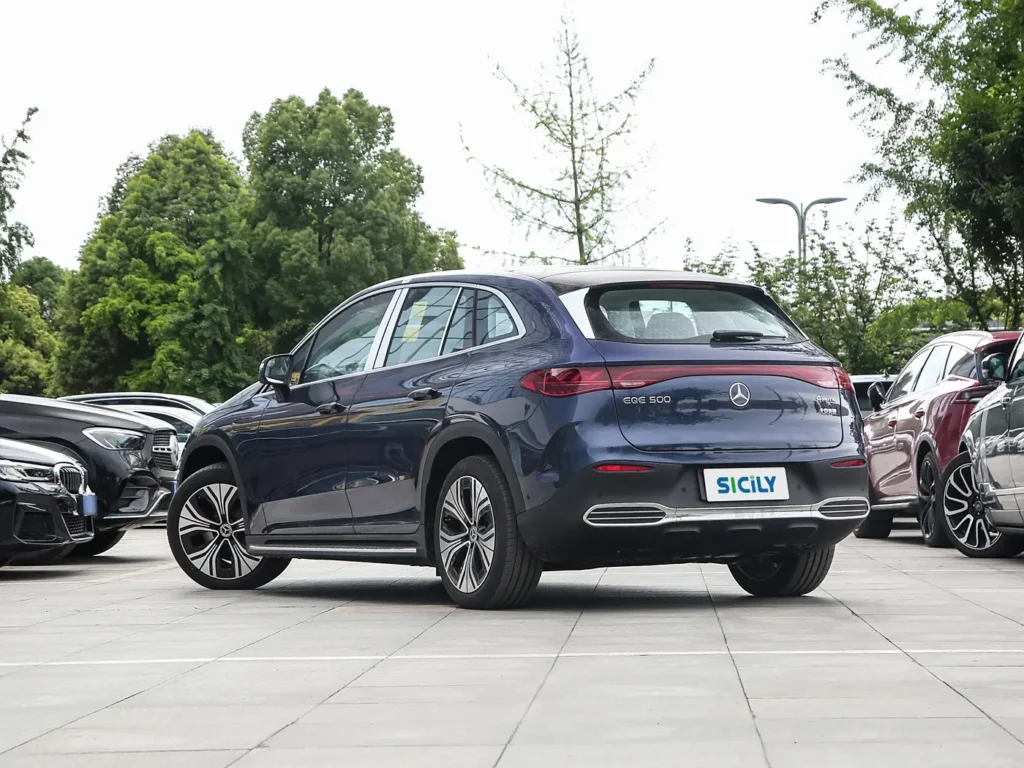 A back view of a dark blue Benz EQE SUV parked