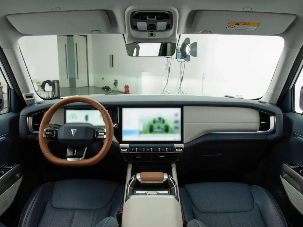 A black interior with a brown steer wheel in Deepal G318